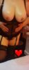 Woman in black lingerie with torso and thighs visible, hands on hips; a pixelated heart covers the pelvic area.