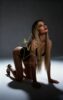 Promotional photo of a woman in black lingerie on all fours, kneeling on a studio floor, looking upward, with 'VIP Greece Vip Escorts' watermark across the image. Promotional photo of a woman in black lingerie on all fours, kneeling on a studio floor, looking upward, with 'VIP Greece Vip Escorts' watermark across the image.
